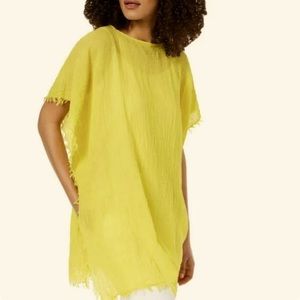 Eileen Fisher's layer-ready neon poncho